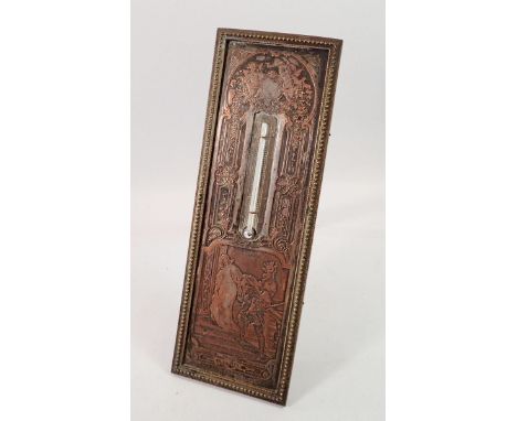 A silver plated on copper thermometer decorated medieval scene on easel stand, 22 x 7.5cm 