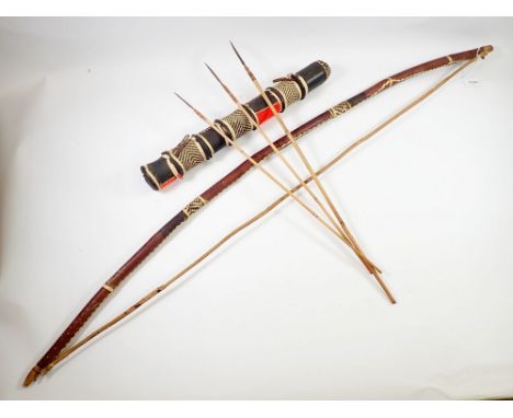 A tribal bow and arrow with three arrows, 126cm long 