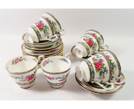 A Paragon Tree of Kashmir tea service comprising eight cups and saucers and eight tea plates 