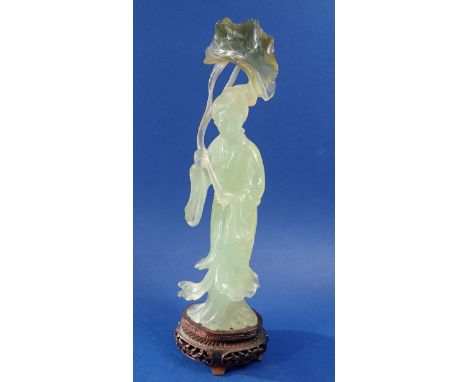 An early 20th century Chinese carved jade figure of a lady holding a lily leaf on carved stand, 26.5cm 