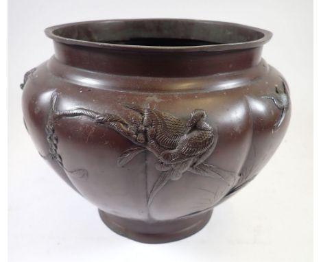 A Japanese Meiji period bronze finish jardiniere with bird and blossom decoration, 22cm tall 