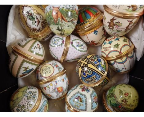 A set of twelve Halcyon Days Easter egg form enamel boxes, 1980 to 1991 