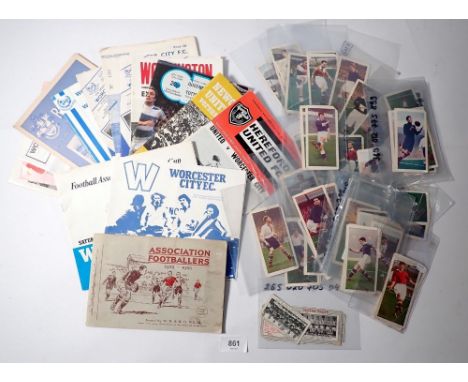 A group of vintage football cards and programmes 