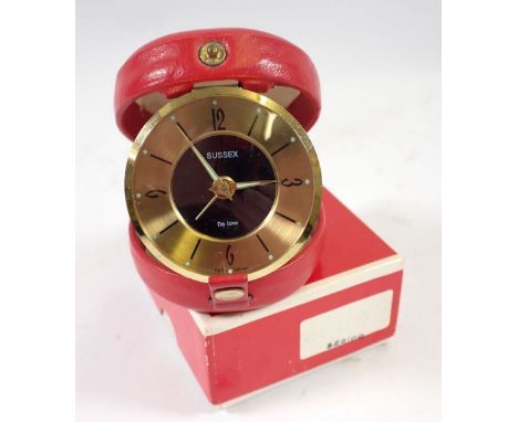 A Sussex De Luxe vintage travel clock in original red leather case 