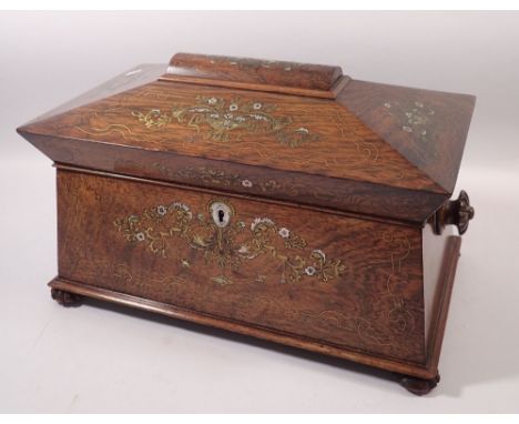 A 19th century fine rosewood sarcophagus form tea caddy with brass and mother of pearl inlay, fitted within two rosewood cadd