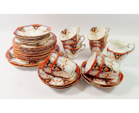 An Edwardian Aynsley tea service comprising ten cups and twelve saucers, eleven tea plates, milk jug and two cake plates 