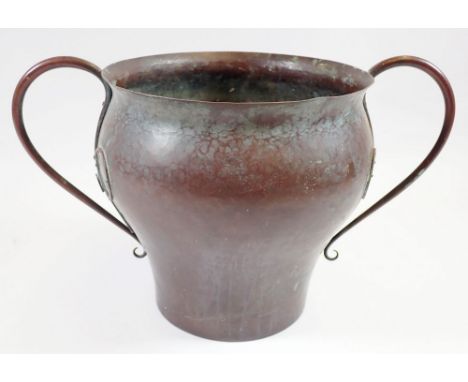 A Victorian beaten copper Arts &amp; Crafts two handled planter, 18cm tall, damage to one tendril and one raised, slight dist