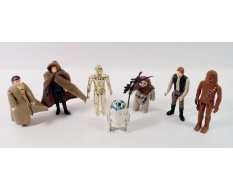 A group of seven loose vintage Star Wars figures Kenner/Palotroy include Luke Skywalker with cape LFL 1983, Han Solo LFL 1984