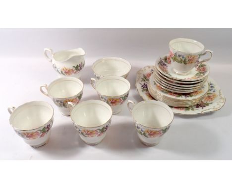 A Paragon tea service 'Country Lane' comprising six cups and saucers, six tea plates, cake plate, milk and sugar 