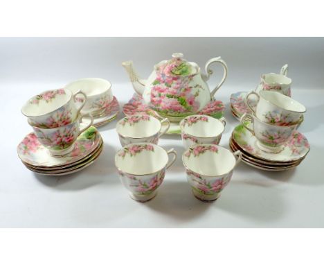 A Royal Albert 'Blossom Time' tea service comprising teapot, eight cups and saucers, milk jug, six tea plates and cake plate,