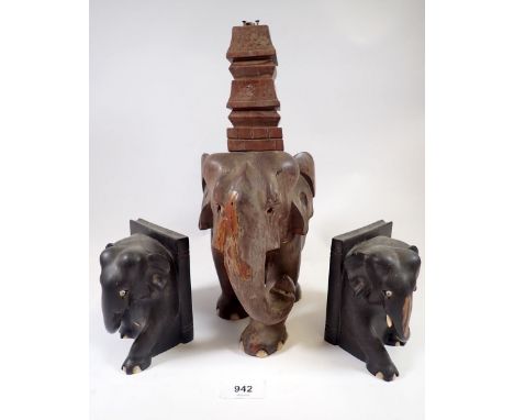 An Indian carved wood elephant and temple table lamp and two ebony elephant bookends (lamp 34cm but lacks fitting) 