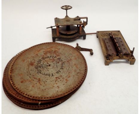 A group of twenty four polyphon discs and a polyphon mechanism 