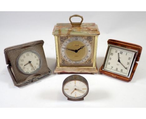 Two vintage travel clocks, a Cyma eight day alarm and an onyx mantel clock by Assisoff 