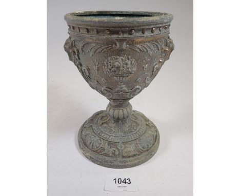 A 19th century spelter oil lamp base with classical cast decoration, 18cm tall 