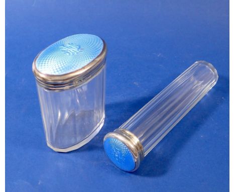 A cut glass toiletry jar and bottle with blue enamel lids, Birmingham 1926, by Adie Bros. 