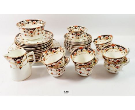 A Beswick Edwardian tea service comprising nine cups and eleven saucers, eleven plates, milk and sugar (one cup a/f) 