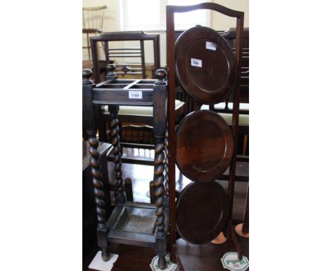 A 1920's mahogany cake stand and an oak barley twist stick stand