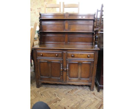 A 1940's Maple's dark oak shelf back dresser