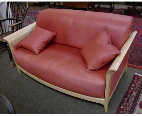 An Ercol Beech and Red Leather Upholstered Two Seat Sofa, 155cm by 92cm by 80cm