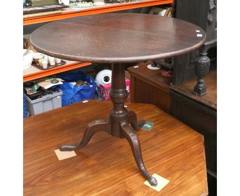 An 18th Century Oak Snap Top Tripod Table, on plane outswept supports, 82cm