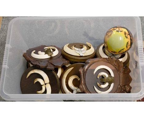 A Box of Wild Boar Tusks Mounted on Wood Shields together with a painted ostrich egg signed Julie Morgan (one box)