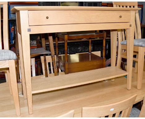 An Ernest Menard Light Oak Single Drawer Console Table, on square tapering supports and with under tier, 110cm by 35cm by 80c