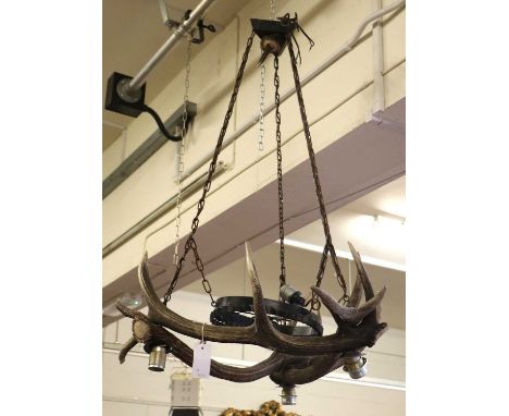 Antler Furniture: An Austro-German Antler Mounted Chandelier, a four-light antler mounted chandelier, constructed with three 