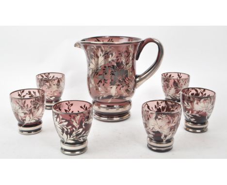 A mid 20th century Italian Murano glass lenonade set. The set featuring a pitcher and six glasses. Each glass having deep ame