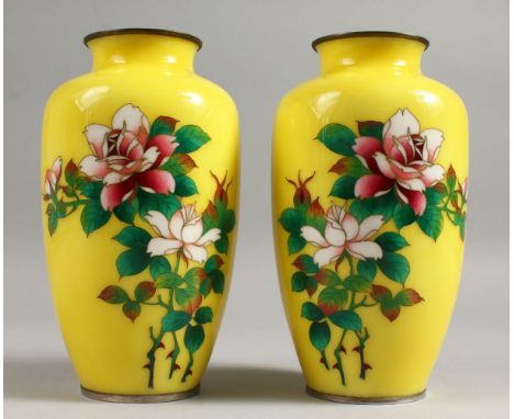 A GOOD PAIR OF YELLOW GROUND CLOISONNE ENAMEL VASES decorated with flowers.7.5ins high.