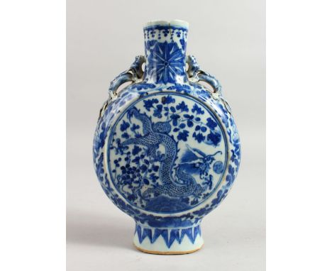 A CHINESE BLUE AND WHITE PILGRIM FLASK with panels of dragons. 10ins high.