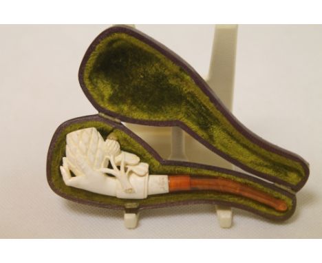 Late 19th century Meerschaum carved "Pine Cone in Hand" pipe with amber stem, as new, 10cm long, cased.