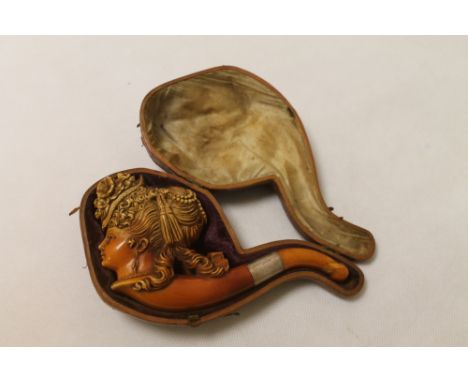 19th century Meerschaum pipe in the form of a lady's head with flowered hat and ornate Belle Epoche flowing hairstyle with ri