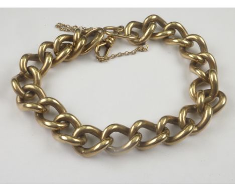 9ct gold curb bracelet.   Condition Report.  55g.Length approx. 20cm.Safety chain prevents accurate measurement. 9ct hall mar