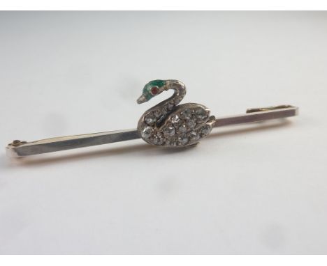 Pin with diamond and enamel swan in gold, platinum fronted. C1900.   Condition Report.  Total length  - 45mm.Swan height - 10