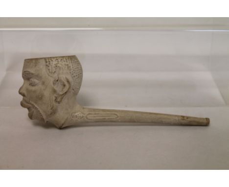 Giant clay pipe in the form of an African man's head by Thomas Holland, 1873, 19cm long.