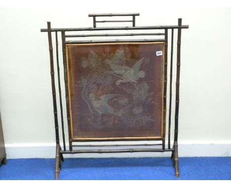 19th century Aesthetic style fire screen with embroidered panel in the Japanese manner in bamboo frame. H91cm