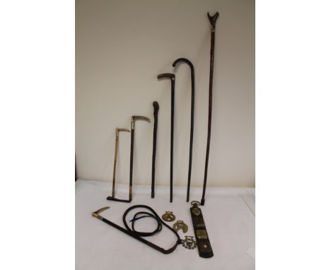Horn handled hunting or coachman's whip, two horn handled riding crops, another three walking sticks and a small collection o