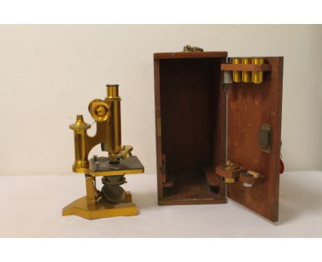 R & J Beck Ltd, London, brass microscope, No 23281, contained in mahogany case with additional lenses. Case 33cm high.