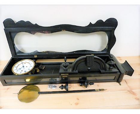 Vienna three train regulator clock with two piece enamel dial and wood and brass pendulum in ebonised case of waved outline, 