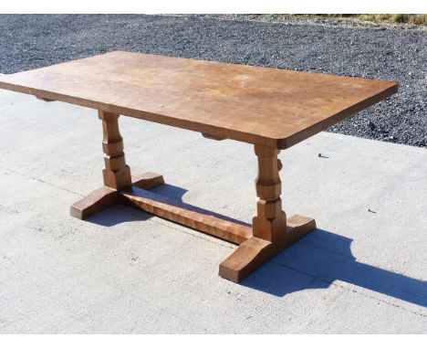 Robert Thompson (Mouseman) English oak refectory table with adzed top, on two octagonal legs joined by a floor stretcher, wit