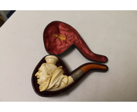Large 19th century Meerschaum Monks head pipe with monogrammed and foliate engraved white metal screw mount to amber stem, 20