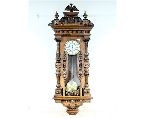 Vienna regulator clock by Gustav Becker with ivory enamel two piece dial, walnut case of elaborate style with waisted glass a