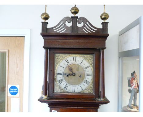 Eight day long case clock by Baylis, Tewkesbury, silvered and brass 10" dial, in oak and elm case with tapering trunk and doo