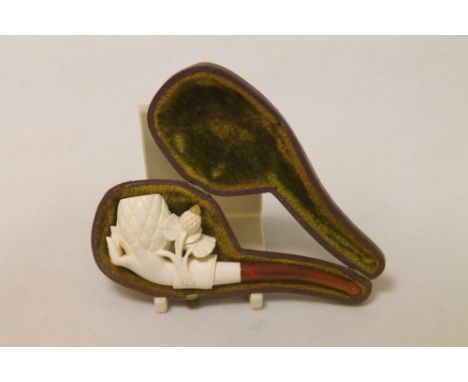 Late 19th century Meerschaum carved "Pine Cone in Hand" pipe with amber stem, as new, 11.5cm long, cased.
