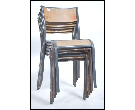 A set of six vintage mid 20th century French stacking chairs. The chairs having metal tubular frames with fitted panel seats.