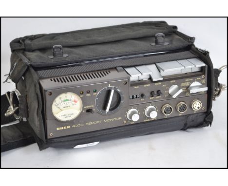A vintage 1980s German Uher 4000 report manager tape recorder with original canvas carry case.