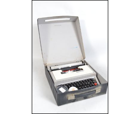 A retro 1970's Underwood 315 model portable typewriter complete in the original vinyl travel carry &nbsp;case