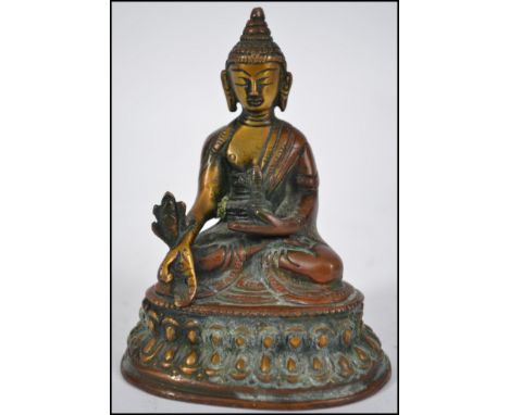 A Chinese bronze figure of a seated Buddha&nbsp;in the Lotus position. Measures 11cm high.
