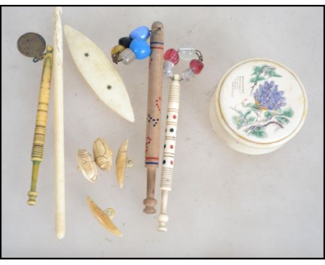 Three 19th century lace makers bobbins together with a 20th century Chinese trinket pot, crochet hook etc.