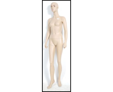A large 20th century full sized shop tailors haberdashery mannequin of a lady ( see illustration ).&nbsp;Measures height 178c